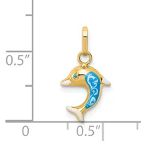 Gold dolphin pendant with blue enamel decoration on its body, shown next to a measurement scale indicating approximately half an inch in height.