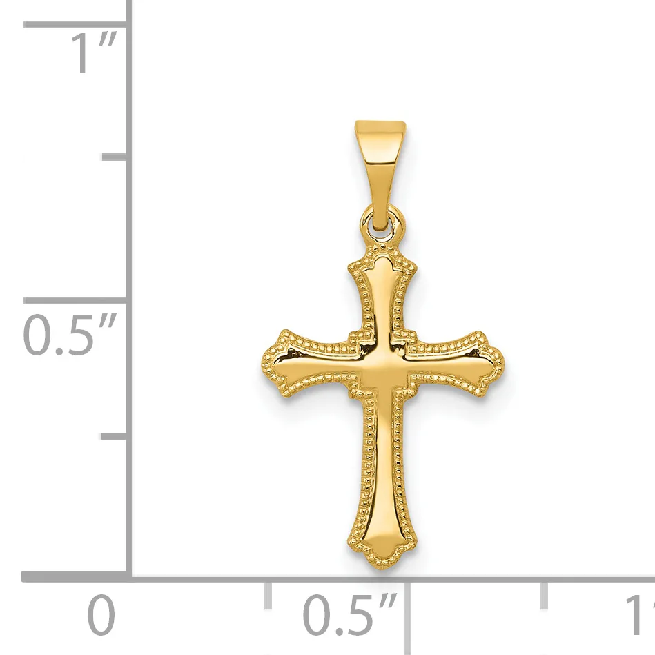 Gold cross pendant with decorative beaded borders and flared ends, shown next to a ruler for scale.