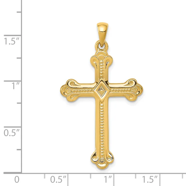 Gold cross pendant with ornate curved ends and a diamond-shaped center stone, shown next to a ruler measuring approximately 1.3 inches in height.