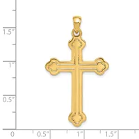 Gold-colored cross pendant with decorative quatrefoil terminals at each endpoint, shown against a measurement scale indicating approximately 1.5 inches in height.
