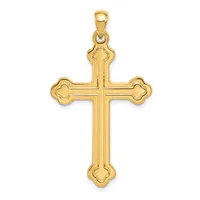 A gold cross pendant with decorative quatrefoil terminals at each end and vertical ridged detailing, shown against a white background.