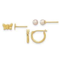 Three pairs of gold earrings displayed against a white background: small bow stud earrings, pearl stud earrings, and small hoop earrings with a hinged clasp.