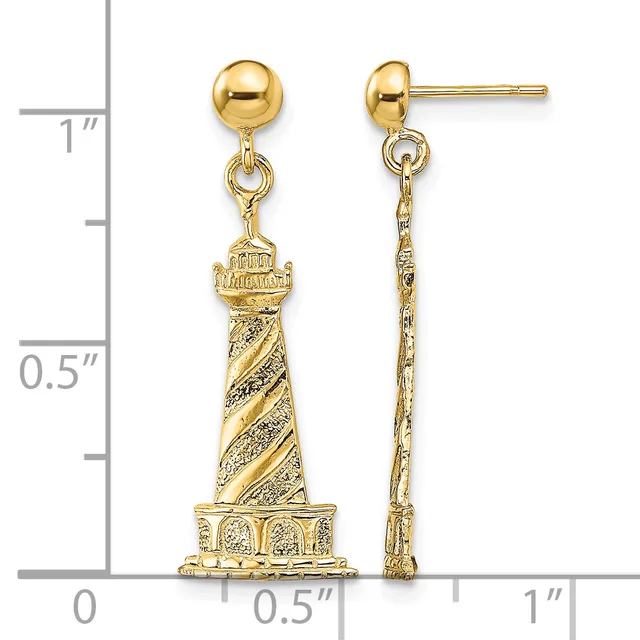 Gold-tone lighthouse charm earrings with ball studs, shown next to a ruler measuring approximately one inch in length.