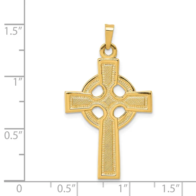 A gold Celtic cross pendant with four circular cutouts arranged in a cross pattern, shown next to a measurement scale indicating it is approximately one inch wide.