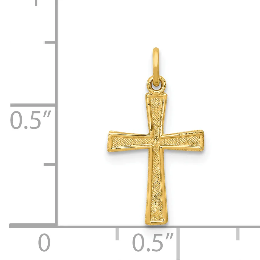 Gold cross pendant with textured surface and loop bail, shown next to a ruler indicating approximately half an inch in height.