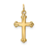 A gold cross pendant with ornate flared ends and a small loop at the top for hanging.
