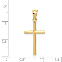 A polished gold cross pendant with a rectangular bail at the top, displayed against a measurement scale showing it is approximately one inch wide and one and a quarter inches tall.
