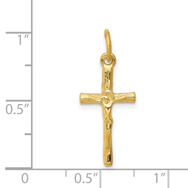 A gold crucifix pendant with a textured corpus, shown against a measurement scale indicating approximately one inch in height.
