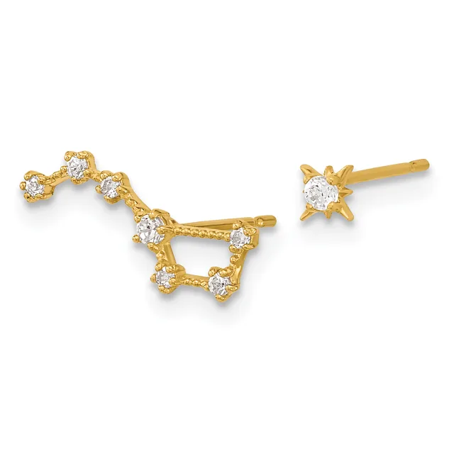 Pair of gold stud earrings with cubic zirconia stones arranged in constellation designs, one larger with seven stones and one smaller with single stone.