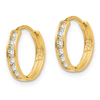A pair of gold hoop earrings with round diamond accents set along the front surface, shown against a white background.