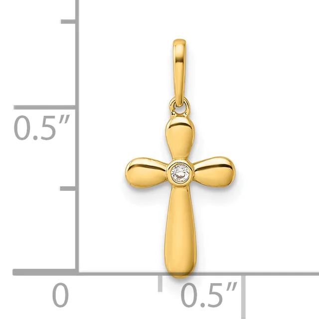 Gold cross pendant with rounded arms and a small diamond at the center, shown next to a ruler indicating approximately half an inch in height.