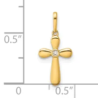 Gold cross pendant with rounded arms and a small diamond at the center, shown next to a ruler indicating approximately half an inch in height.