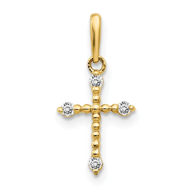 A gold cross pendant with diamond accents at each of the four cardinal points and suspended from a gold bail.