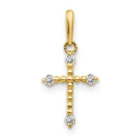 A gold cross pendant with diamond accents at each of the four cardinal points and suspended from a gold bail.
