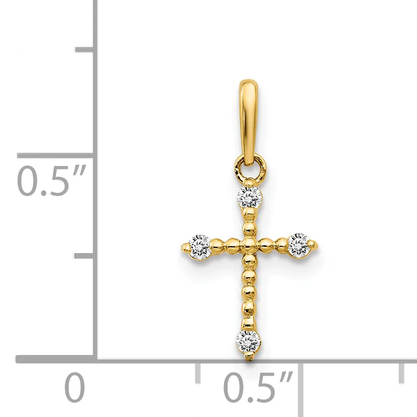 Gold cross pendant with diamond accents at each end and top, shown next to a ruler indicating approximately half inch width.