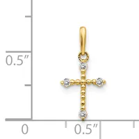 Gold cross pendant with diamond accents at each end and top, shown next to a ruler indicating approximately half inch width.