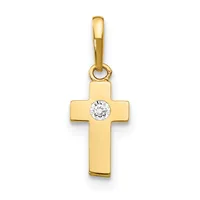 A gold cross pendant with a round diamond or cubic zirconia stone set at the center, suspended from a gold bail.