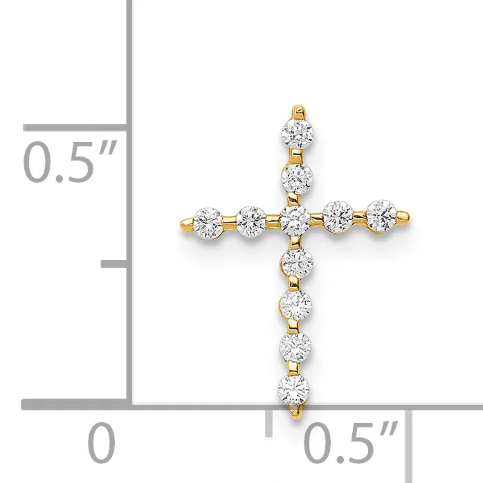 A gold cross pendant with round diamond stones arranged in a cross pattern, shown next to a ruler indicating the pendant is approximately half an inch wide and tall.