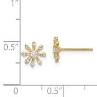 Pair of gold stud earrings with daisy flower design set with round cubic zirconia stones, shown next to a measurement scale.
