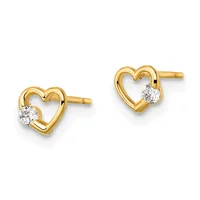 A pair of gold heart-shaped stud earrings, each featuring a round diamond set on the right side of the hollow heart outline.