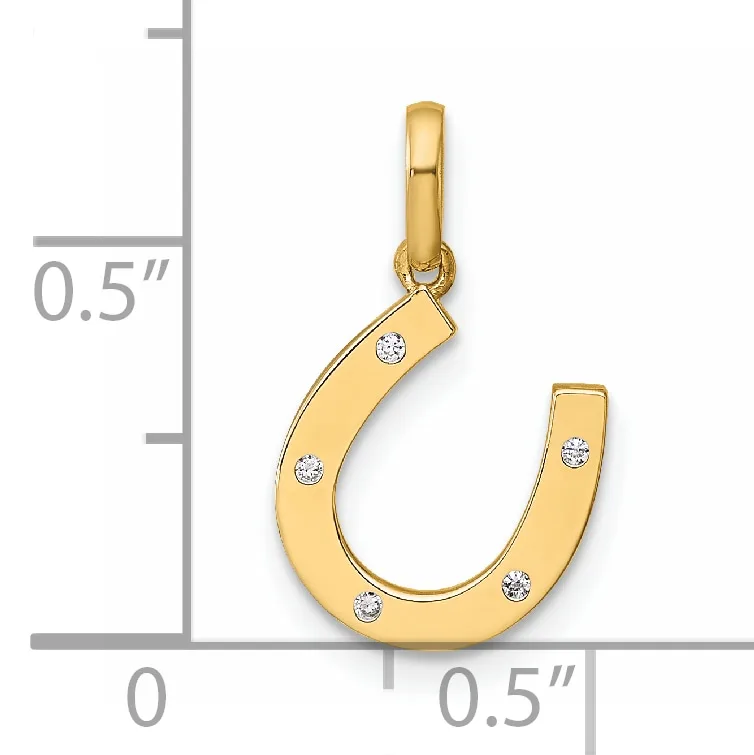 Gold horseshoe pendant with diamond accents shown next to a measurement scale indicating approximately half inch width and height.