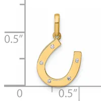 Gold horseshoe pendant with diamond accents shown next to a measurement scale indicating approximately half inch width and height.