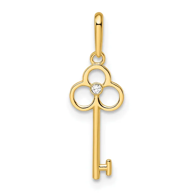 A gold key-shaped pendant with a trefoil clover design at the top set with a small diamond, suspended from a gold bail.