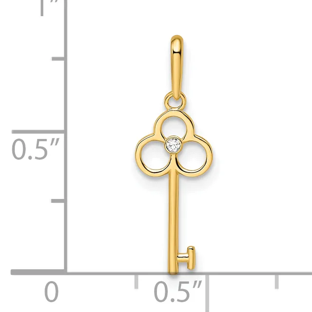 Gold-colored key pendant with three circular loops at the top and a small diamond or crystal stone at the center, shown next to a ruler for scale.