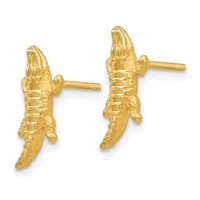 A pair of gold stud earrings shaped like crocodiles with detailed scales and textured bodies, shown from the front against a white background.