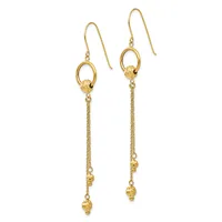 Pair of gold-tone dangle earrings with hook closures, featuring oval rings at the top and delicate chains with small textured beads hanging below.