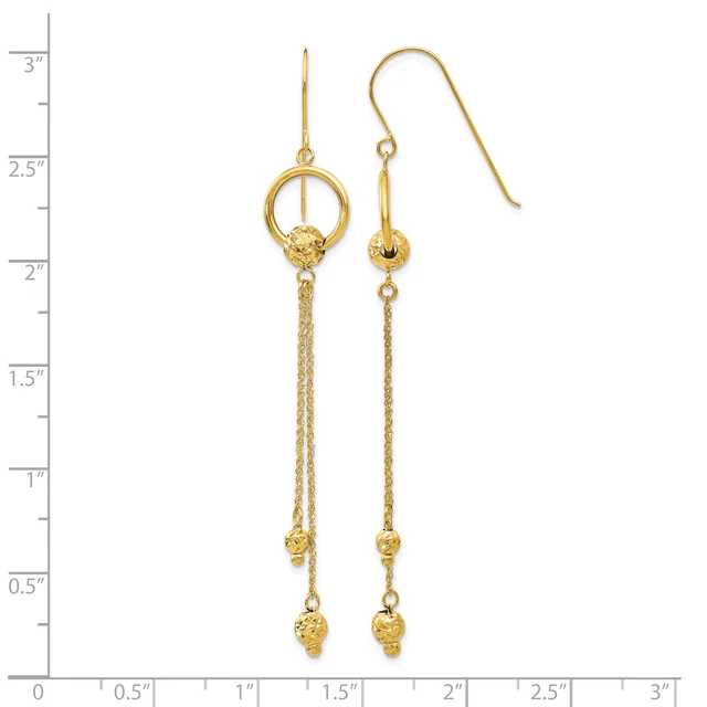 Pair of gold dangle earrings with textured chains, small beads, and circular loop details at the top, displayed against a measurement scale.
