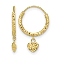 Pair of gold hoop earrings with textured surface finish and dangling heart-shaped charms attached by small loops.