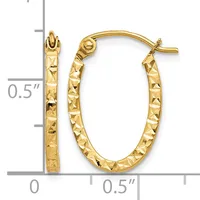 Pair of gold oval hoop earrings with textured diamond-cut surface finish, shown with measurement scale indicating approximately 0.5 inches in height.