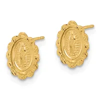Pair of gold oval stud earrings with ornate leaf-shaped surrounds featuring a central religious medallion with a figure and radiating lines.