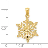 Gold snowflake pendant with textured petals shown next to a ruler measuring approximately one inch in height.
