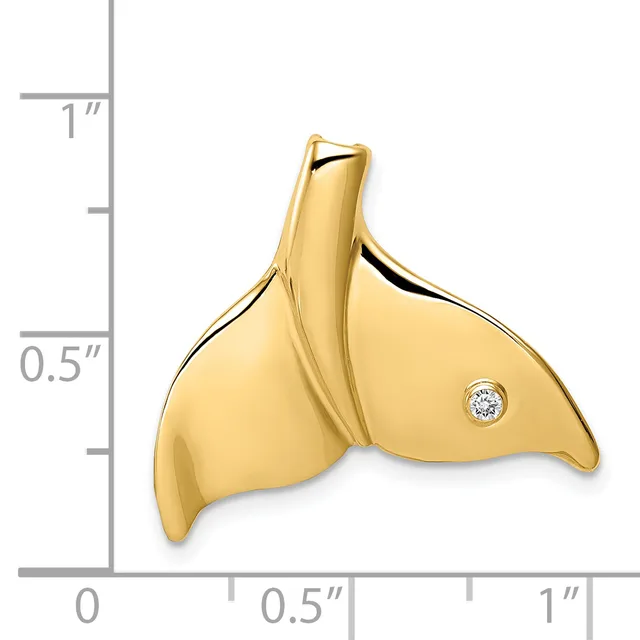 Gold whale tail pendant with a small diamond accent, shown next to a ruler for scale.