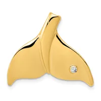 A gold whale tail pendant with a small diamond set in the right fluke, shown against a white background.