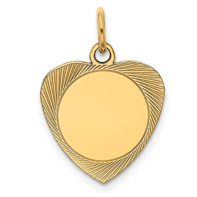 A gold heart-shaped pendant with a polished circular center surrounded by a textured radiating pattern, hanging from a small bail loop.