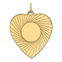 Gold heart-shaped pendant with radiating line pattern and circular cutout in center, suspended from a small loop bail.