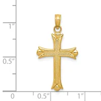 Gold cross pendant with textured surface and flared ends, shown next to a ruler indicating approximately one inch in height.