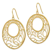 A pair of gold filigree oval dangle earrings with intricate openwork leaf patterns throughout, shown hanging from gold ear wires.
