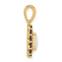 Gold-toned pendant with an oval loop bail at top, featuring a rectangular stone setting surrounded by decorative metalwork and small dark gemstones arranged in a vertical pattern.