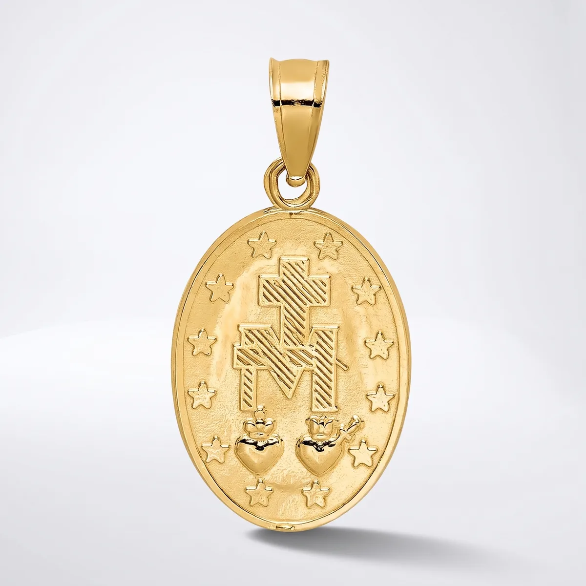 A gold oval pendant featuring a cross with radiating lines, surrounded by stars, and two small heart shapes at the bottom, suspended from a gold bail.