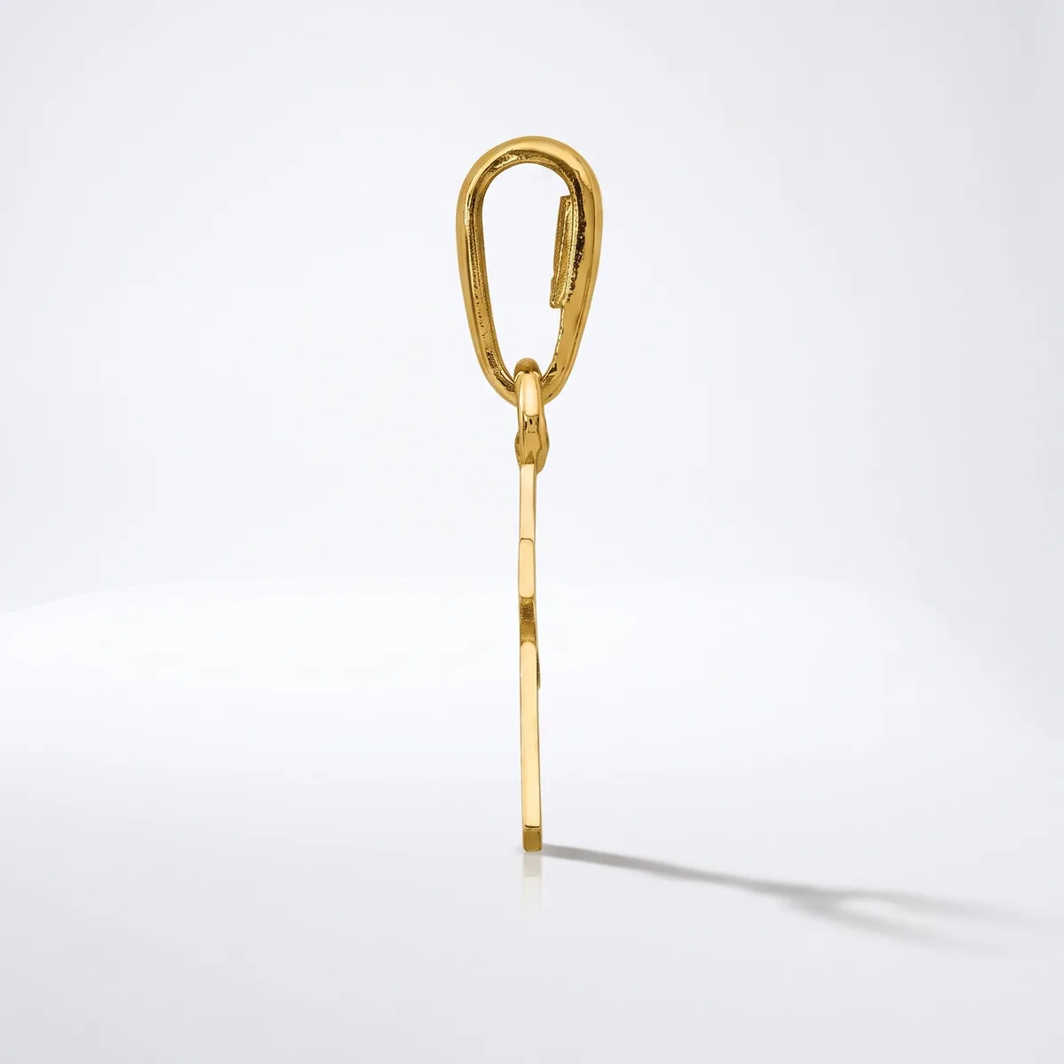 A gold-toned metal carabiner clip with an elongated oval shape and a thin chain attached to its base, displayed against a white background.