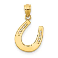 A gold horseshoe pendant with a small hallmark, featuring pearl or white stone accents along both arms, suspended from a gold bail.