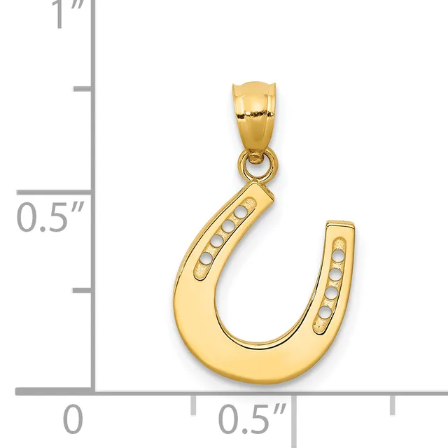 Gold horseshoe pendant with decorative dots along the curved sides, shown next to a ruler indicating approximately one inch in height.