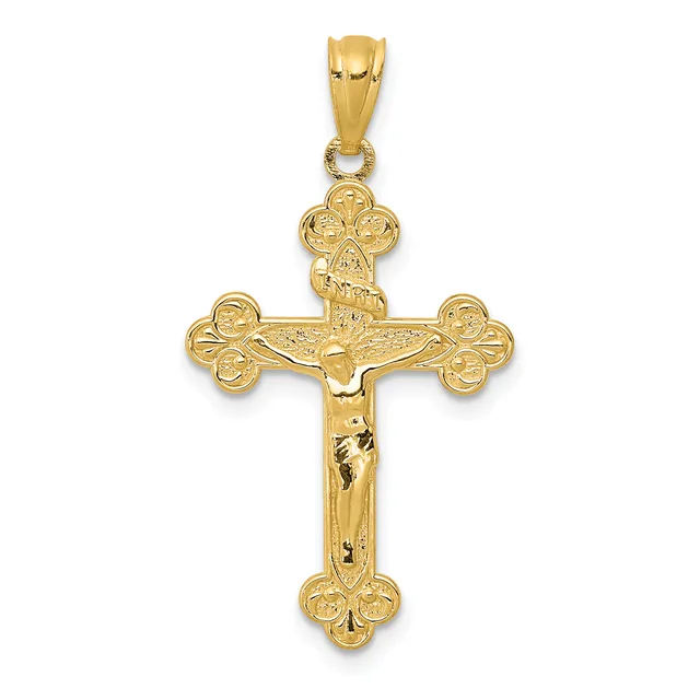 Gold crucifix pendant with ornate trefoil ends and a corpus figure, shown hanging from a bale against a white background.