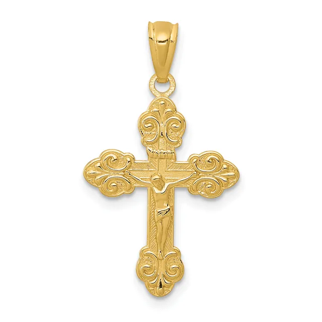 A gold cross pendant with ornate scrollwork on the ends of each arm and a small hallmark, shown hanging from a bail loop.
