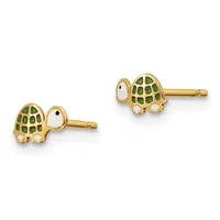 A pair of gold stud earrings shaped like turtles with green enamel shells and white enamel eyes, shown from front and side views.