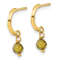 A pair of gold hoop earrings with faceted olive-green stone drops attached to small gold loops at the bottom.